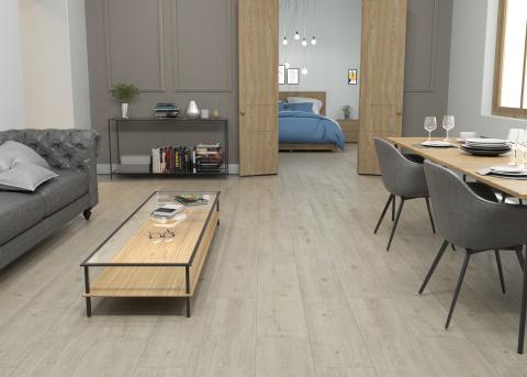 This modern design utilizes minimalist ideas, industrial features, and varied surfaces, with AquaSeal XTend 'Eclipse Oak' Laminate flooring.